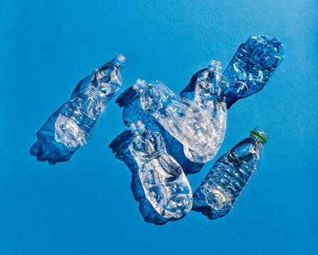 Plastic bottles on blue background
