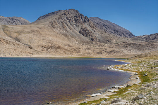Mountain landscape view of colorful high altitude lake between Khargush pass and Pamir Highway, Murghab, Gorno-Badakhshan, Tajikistan