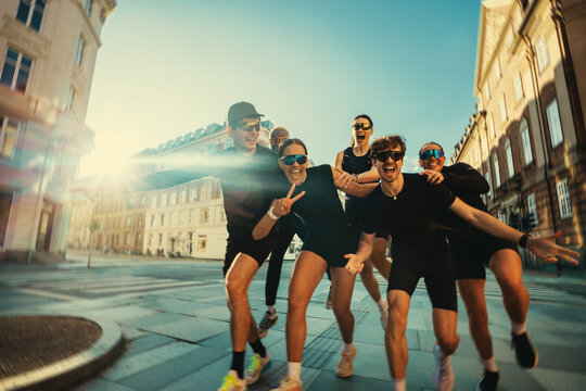 Posing in the sun, the running friends gather together after group fitness