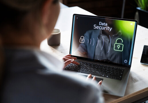 Working on a notebook with data security concept on the screen