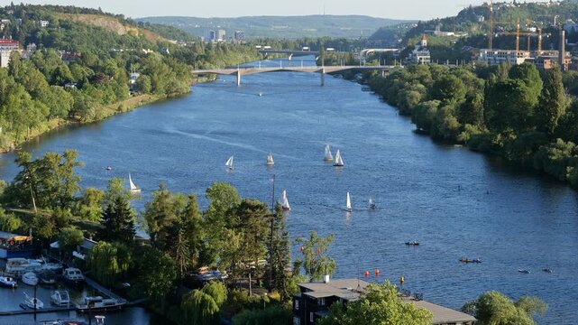 Sailing boats on Vltava river in city of Prague, Czechia (Czech Republic).