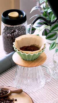 Drip brewing filtered coffee or pour-over is a method involves pouring water over roasted ground coffee beans contained in filter.	