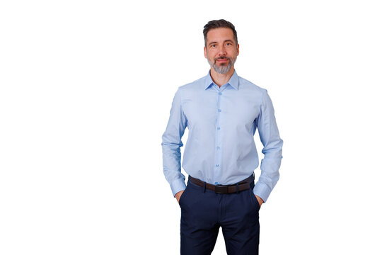 Confident businessman standing with hands in pockets, looking at camera, having a slight smile, on transparent background