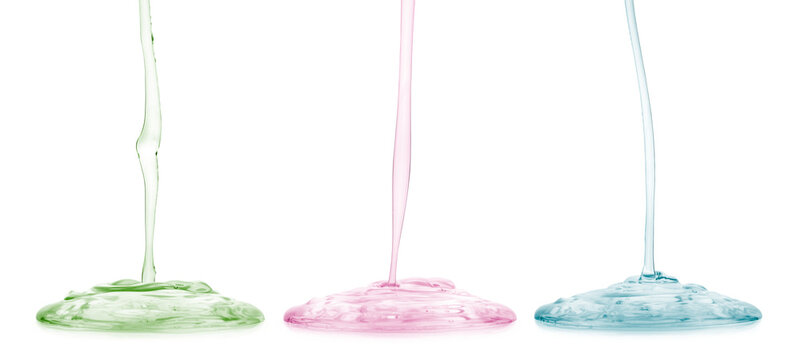 Transparent cosmetic gel or face serum product dripping in different colours, isolated on transparent background. PNG image.