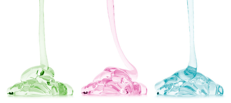 Transparent cosmetic gel or face serum product dripping in different colours, isolated on transparent background. PNG image.