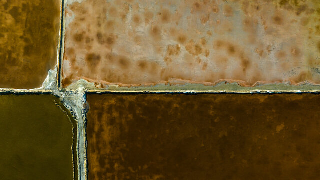Salt evaporation ponds with mineral deposits and water