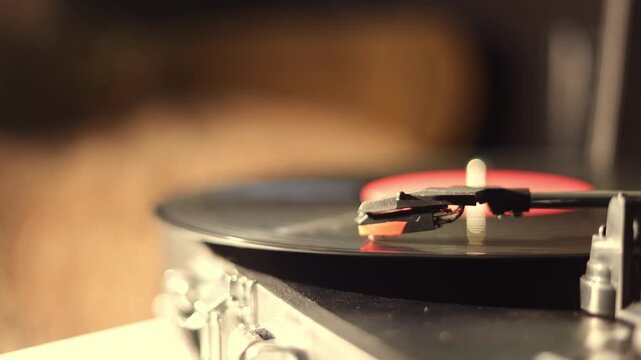 Close-up of a vintage record player needle on a spinning vinyl disc