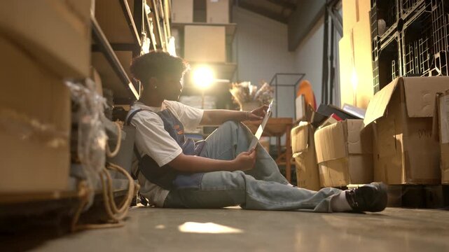 Stressed shop worker feeling pressure while working in a storage area of a small handmade business