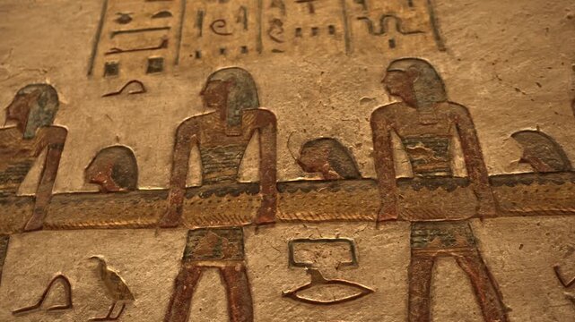A detailed view of the polychrome wall reliefs inside the Tomb of Ramesses III (KV11) in the Valley of the Kings, Luxor, Egypt.