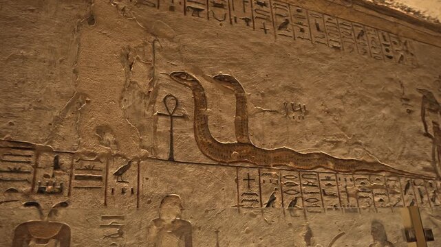 A detailed close-up shot of the exquisite raised limestone reliefs inside the Tomb of Ramesses III (KV11) in the Valley of the Kings, Luxor, Egypt.