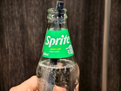 Eskilstuna, Sweden-Nov.27th 2025: glass bottle of Sprite with brand logo