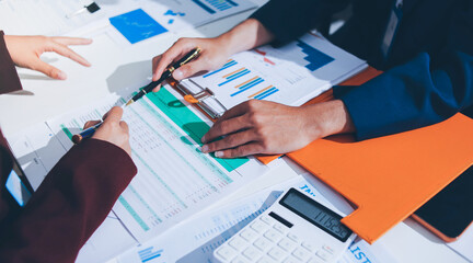 Fototapeta premium Accounting company provide finance and taxation planning for profitable cash flow, Auditor and accountant team working in office, analyze financial data and accounting record with calculator