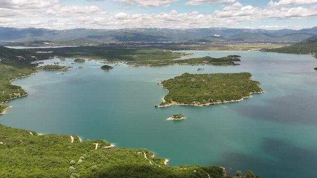 Stunning aerial drone footage of Slano Lake (Slano Jezero) near Nik&scaron;ić, Montenegro, showcasing its unique landscape