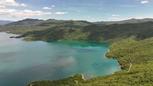 Stunning aerial drone footage of Slano Lake (Slano Jezero) near Nik&scaron;ić, Montenegro, showcasing its unique landscape