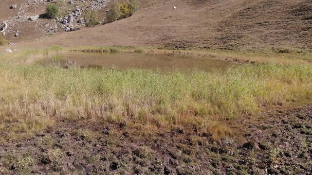 Caucasus, North Ossetia. Ualak Gorge. A shallow mountain lake.