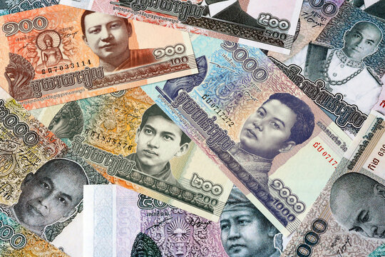 Cambodian riel money bills in pile on table. Cambodia KHR currency cash close up