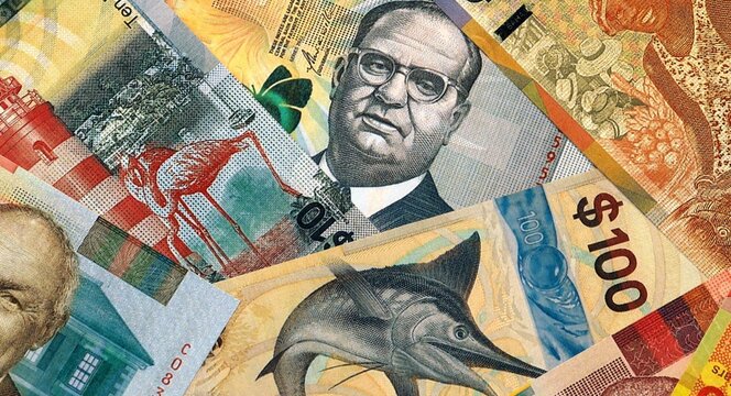 Bahamian dollar money bills in pile on table. Bahamas BSD currency cash close up