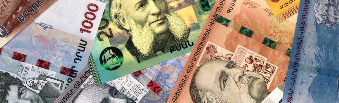 Armenian dram money bills in pile on table. Armenia AMD currency cash close up