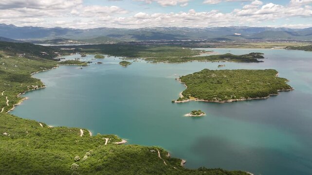 Stunning aerial drone footage of Slano Lake (Slano Jezero) near Nik&scaron;ić, Montenegro, showcasing its unique landscape