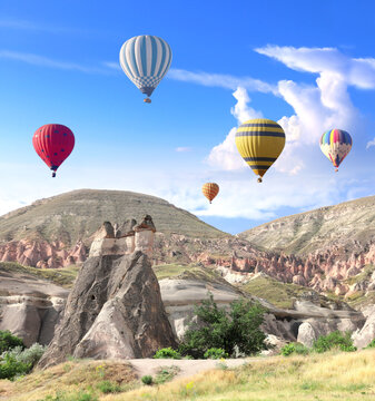 Balloon flight, famous tourist attraction of Cappadocia. Air balloons and Fairy Chimney in Pasabag Valley, Anatolia, Turkey. Topic of vacation, travel, trip abroad on vacation, cruises and tours