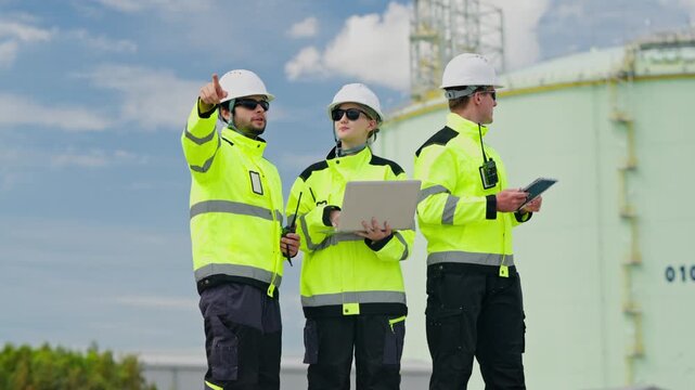 Team collaboration on industrial site safety compliance outdoor environment digital strategy professionalism action-packed viewpoint