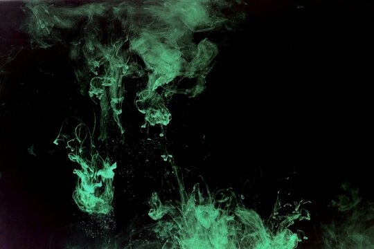 Abstract green or light green watercolor spread or stain on black background,Color Abstract,Green fluorescent