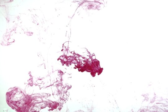 Red color on white background,Abstract smoke pattern,Colored liquid dye,Splash paint
