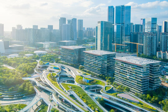 Aerial view of Shenzhen futuristic urban district with green rooftop architecture and modern skyscrapers Sustainable city planning, innovative infrastructure and smart urban development, China