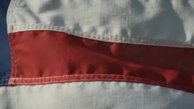 Close Up of American Flag Fabric Waving in Dramatic Light