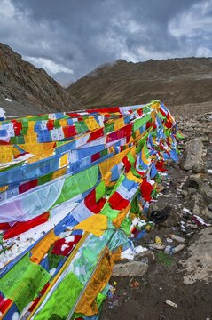 Praying flags and stones on a mountain pass, Kailash Kora, Western Tibet, Asia