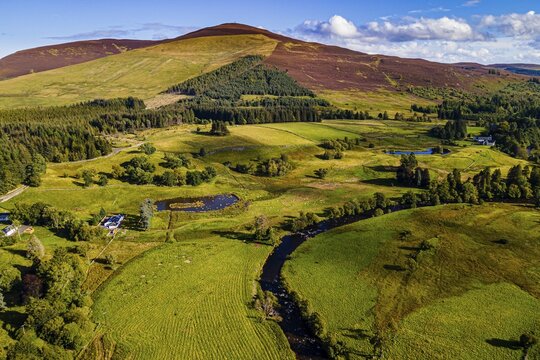 Aerial of the beautiful scenery around Dalnaglar Castle, Glenshee, Scotland, UK