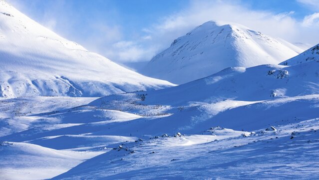 Light and shadow over snowy hilly landscape, near Akureyri, Northern Iceland Eyestra, Iceland