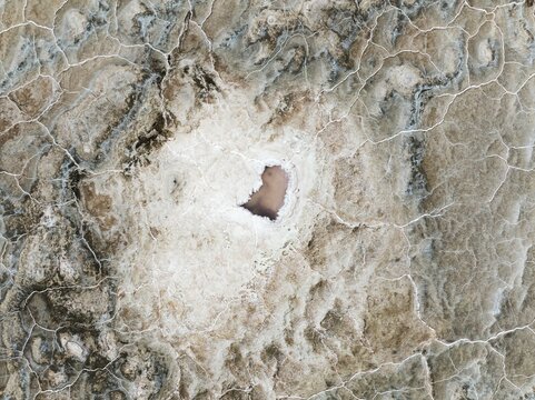 Abstract patterns of saline deposits at the salt works of Walvis Bay. Aerial view. Drone shot. Namibia