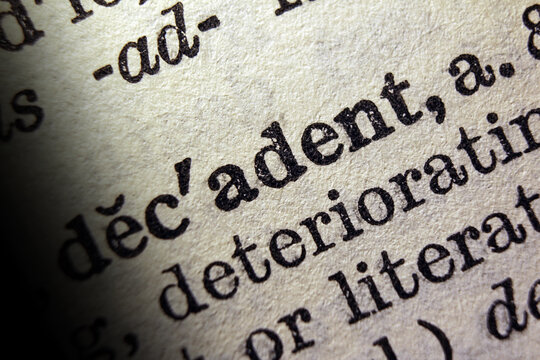 Word decadent on dictionary page, macro close up