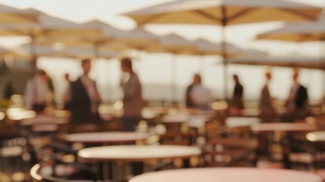 Business professionals networking at an outdoor caf&eacute; during sunset. A vibrant atmosphere for collaboration and social interaction