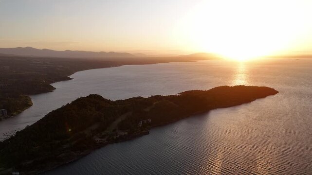 Aerial view of forested peninsula at golden hour, Patagonia, Chile.