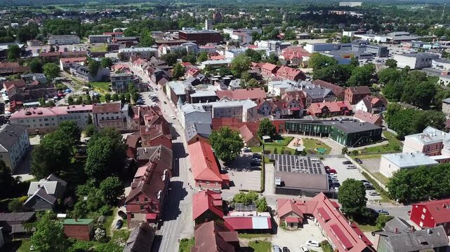 Low altitude drone shot highlighting the unique wooden and brick architecture in the historic old town area of Viljandi, Estonia in 2026.