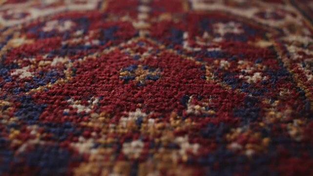 Close-up macro shot of intricate Persian rug texture, warm colors, slow zoom out