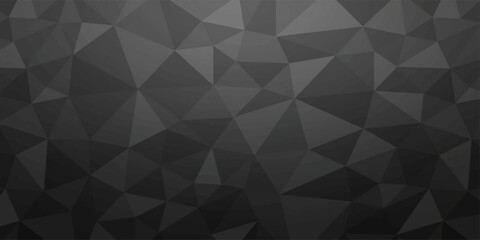 Obraz premium A dark, monochromatic geometric background features a repeating pattern of irregular triangles in various shades of gray, creating a low-polygon abstract texture.