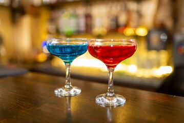 Fototapeta premium Two cocktails on wooden bar counter