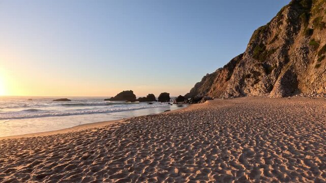 POV Walk Across Praia da Ursa at Sunset, Golden Light on Sea Stacks and Atlantic Shore, Portugal