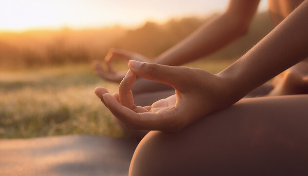 Close Up of Female Hands Meditating During Sunrise Yoga