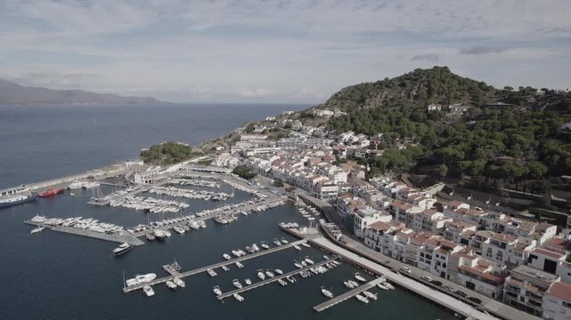 Aerial Drone Tilt Down Reveal Over Port de la Selva Town, Costa Brava, Spain