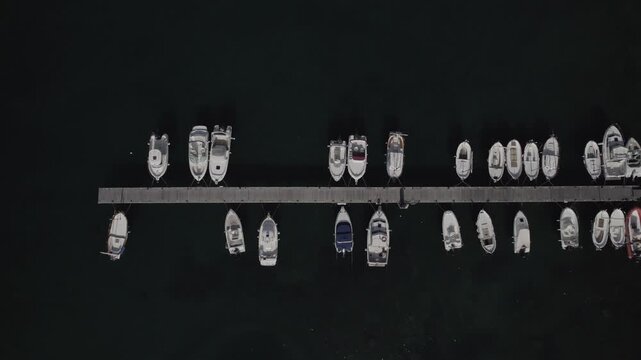 Aerial Drone Lateral Tracking Zenithal Shot Over Harbour Dock in Port de la Selva, Costa Brava, Spain