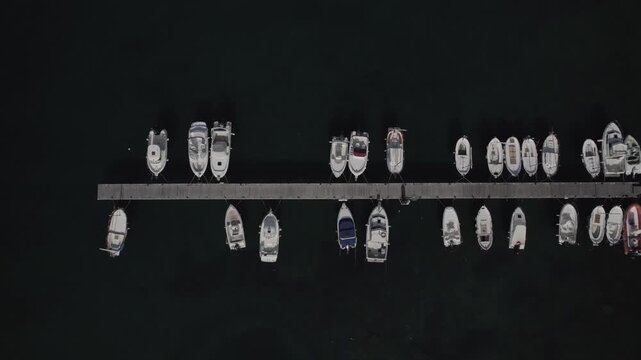 Aerial Drone Lateral Tracking Zenithal Shot Over Harbour Dock in Port de la Selva, Costa Brava, Spain
