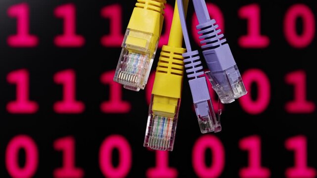 Multiple colorful Ethernet cables connected against a background of red binary code digits. The image symbolizes digital communication, data transfer, internet infrastructure, and networking.