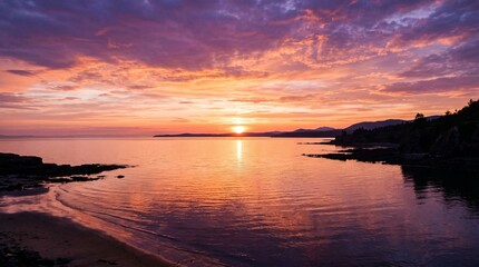 Fototapeta premium Stunning Sunset Over Calm Coastal Waters with Silhouetted Shoreline