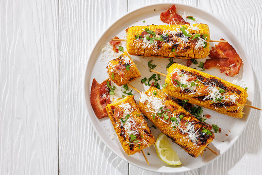 Roasted sweet corn is served on a plate