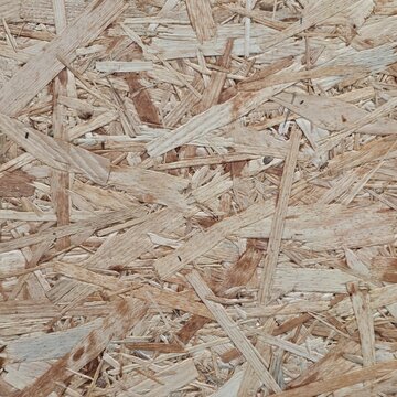 Oriented strand board OSB texture background, engineered wood panel sheet