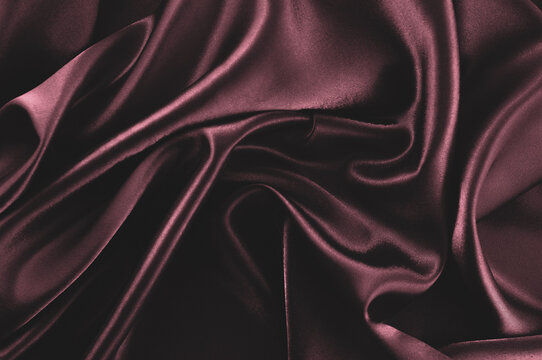 Dark red silk fabric textured background